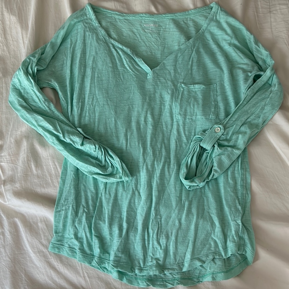 Light green long sleeve t shirt, front pocket accent
